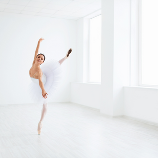 Dancing Ballerina Dressed in White