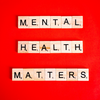Scrabble tiles spelling "Mental Health Matters"