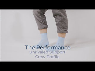 Compression socks for women in various colors are modeled on feet walking across the screen